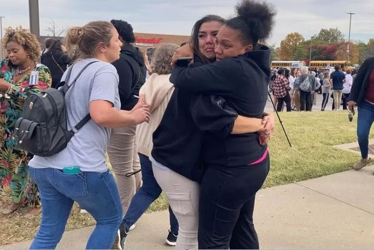Families outside the school grieving and consoling each other in St Louis Missouri school shooting